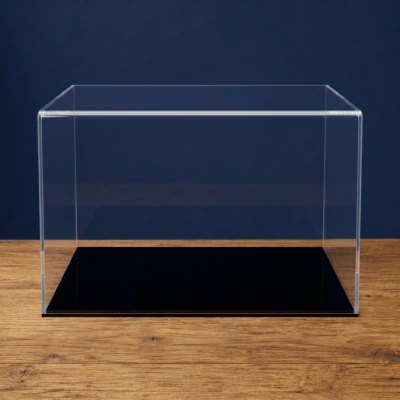 Main image of the custom sized acrylic display case with a black low profile base, on an oak table in front of a dark blue background