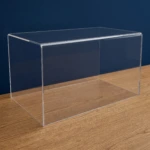 Custom sized acrylic display cover image, shown on a wooden table against a dark blue wall