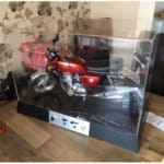 Main image for the  Acrylic Display Cover for the Deagostini 1/4 Scale Honda CB750 Model, which is shown on its base with the acrylic cover fitted.