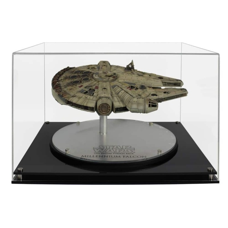 The EFX 1:100 scale model Millennium Falcon inside an acrylic display case with a black modern acrylic base