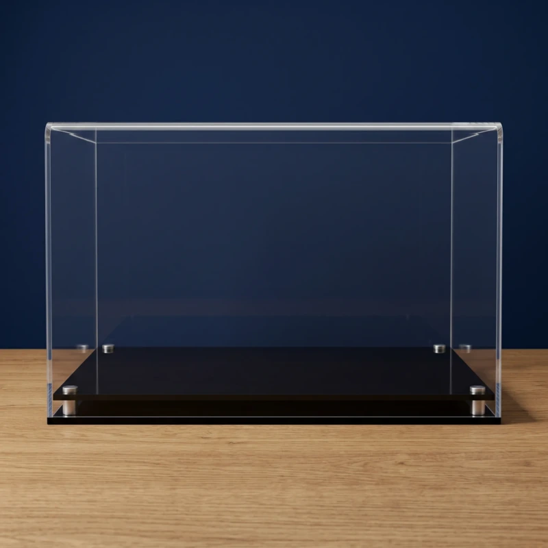 Image of the custom sized acrylic display case with a modern base, shown empty, on a wooden table with a dark blue background