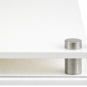 Closeup image of the corner of the white modern base, showing the acrylic and the stainless steel corner support