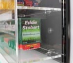 Side view of the model truck display case with a black back panel, showing the models inside