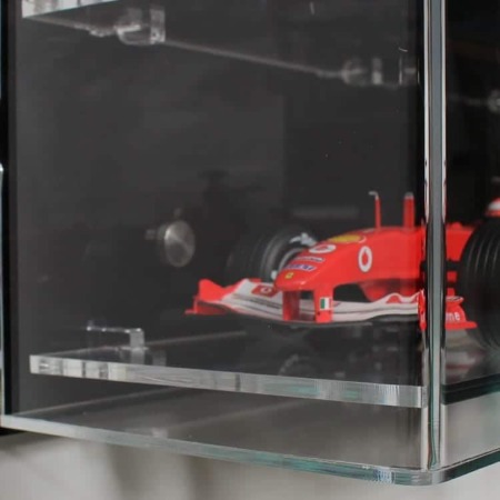 Side view of the 1:18 scale model F1 Car display case with a black back panel, showing the models inside
