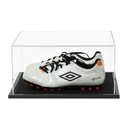 A pair of football boots displayed inside our acrylic display case with wooden base