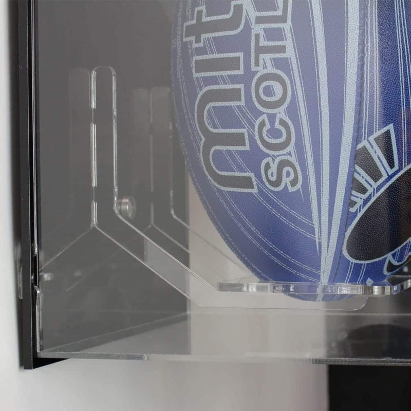 Close-up side view image for the Acrylic Wall Display Case for a Signed Rugby Ball, shown with a black back, and containing a blue rugby ball