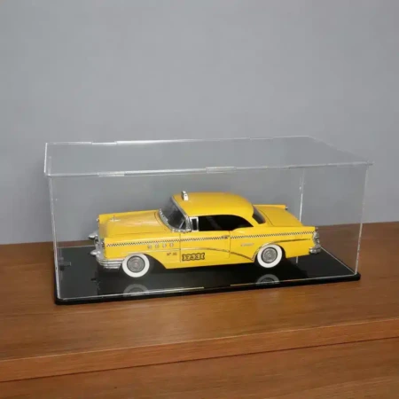 1:18 Scale Model Car Stackable Display case, shown with a black base and a clear back, contains a yellow US taxi.