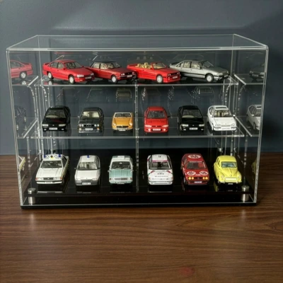 Image of the desktop 1:43 scale car display case show full of cars and on a dark grey background