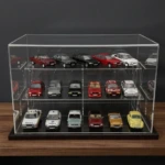 Image of the 1:43 scale model car desktop display case shown on a wooden shelf with a dark grey background